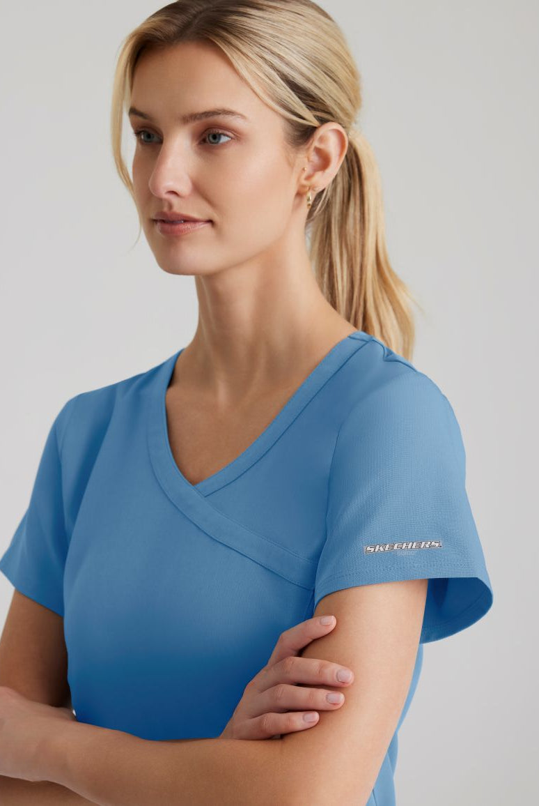 SKECHERS FEMALE RELIANCE 3-POCKET WRAP EFFECT TOP | TRUE CEIL