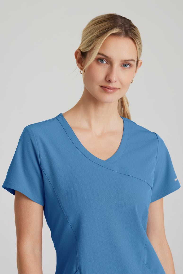 SKECHERS FEMALE RELIANCE 3-POCKET WRAP EFFECT TOP | TRUE CEIL