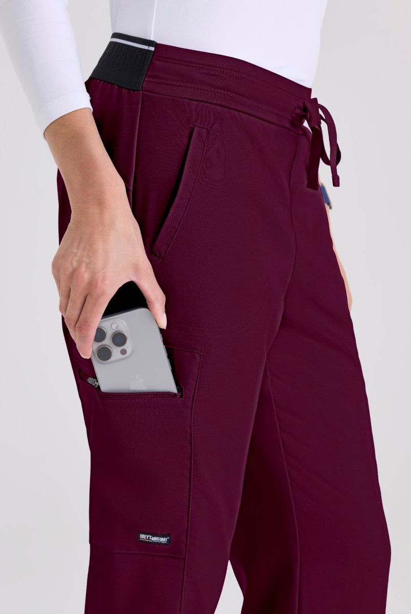 Greys Anatomy Kim 3 Pocket Elastic Back Waistband Zip-Pocket Pants | Wine