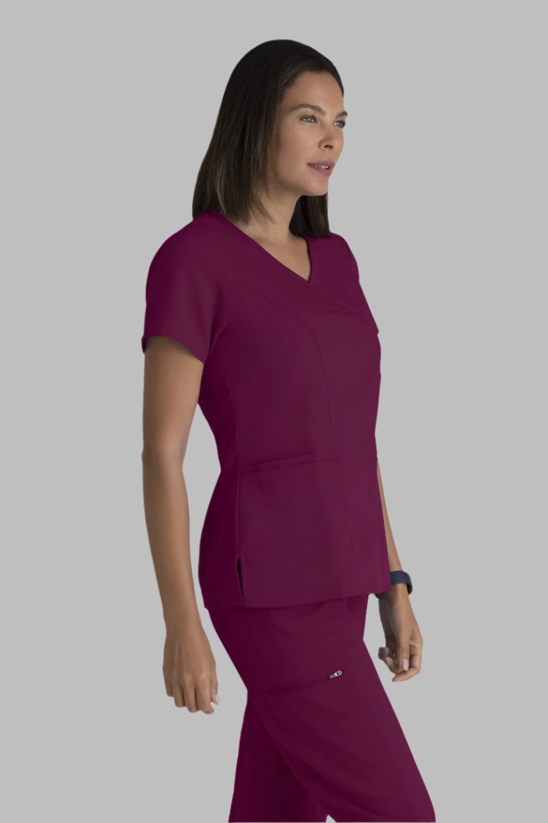 Greys Anatomy V-Neck Kim Top with Zip Front Pocket | Wine