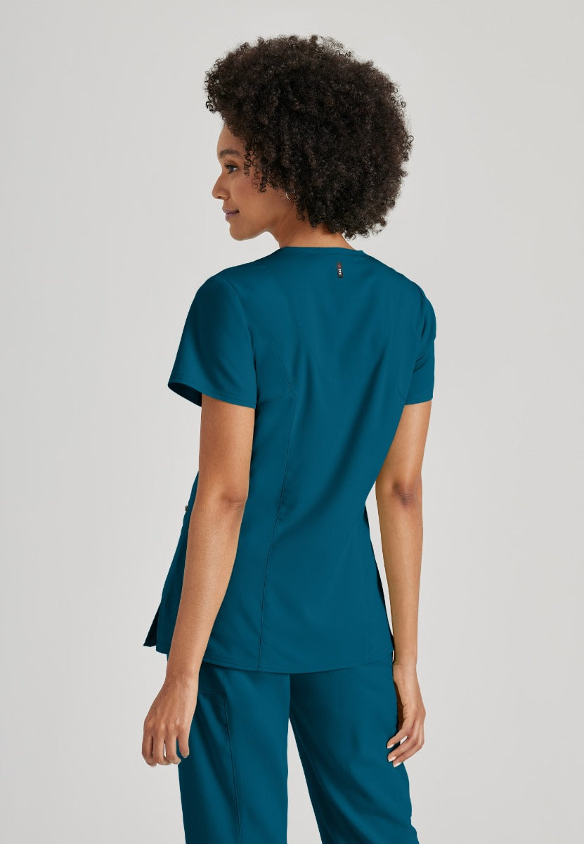 Greys Anatomy V-Neck Kim Top with Zip Front Pocket | Bahama / Caribbean