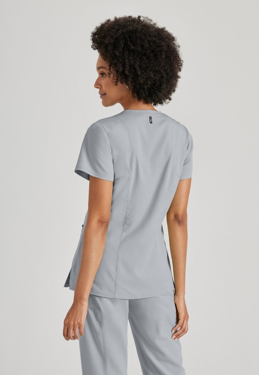 Greys Anatomy V-Neck Kim Top with Zip Front Pocket | Moonstruck
