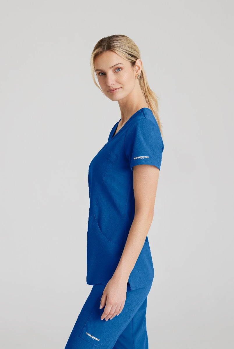 SKECHERS FEMALE RELIANCE 3-POCKET WRAP EFFECT TOP | New Royal