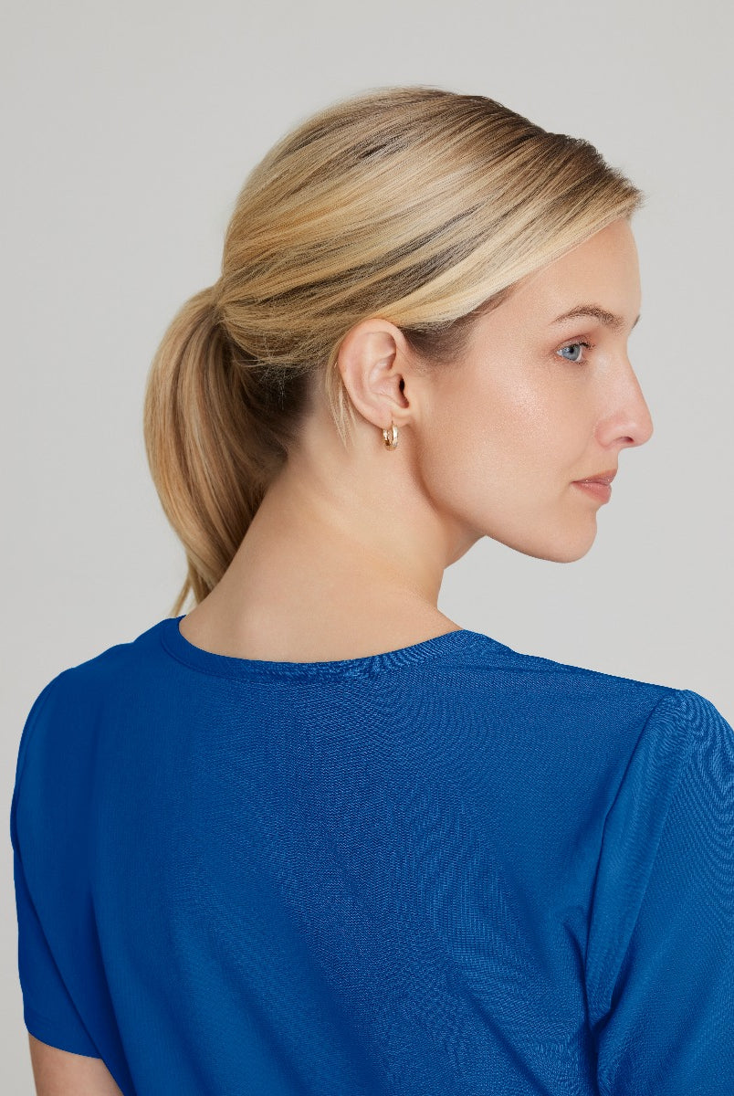 SKECHERS FEMALE RELIANCE 3-POCKET WRAP EFFECT TOP | New Royal