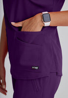Greys Anatomy Emma 4 pocket, V-neck scrub top with angled seams | Eggplant